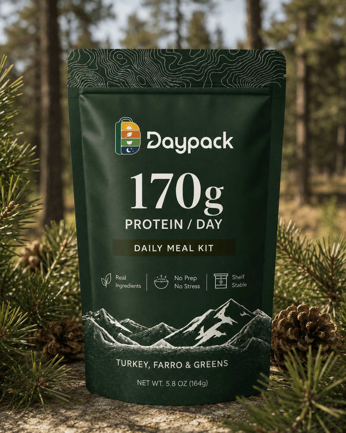Daypack 170g daily meal kit pouch in deep pine green on a forest floor with pine cones.